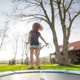 kid on trampoline